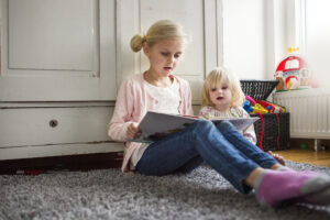The Carpet Cleaners - Children reading on rug